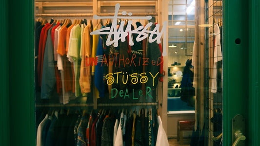 a store window with a sign that says shop