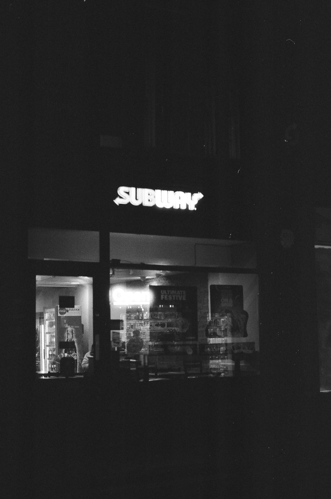Subway restaurant illuminated at night